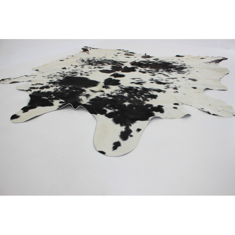 Vintage black and white cowhide rug