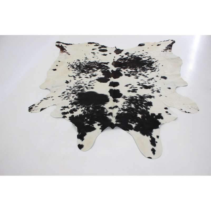 Vintage black and white cowhide rug