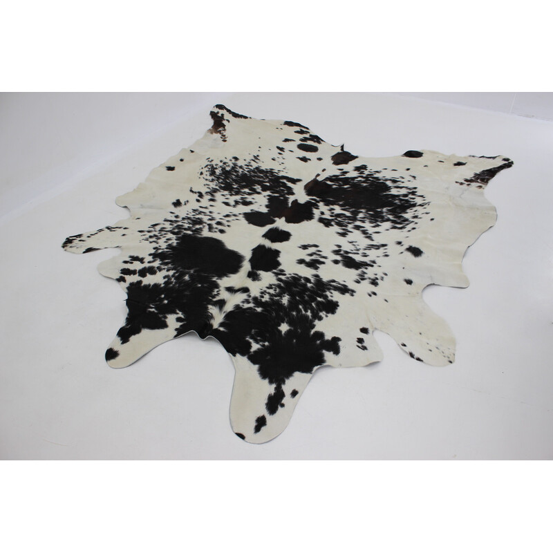 Vintage black and white cowhide rug