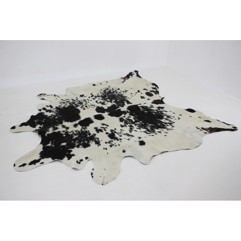 Vintage black and white cowhide rug