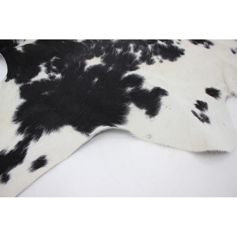 Vintage black and white cowhide rug