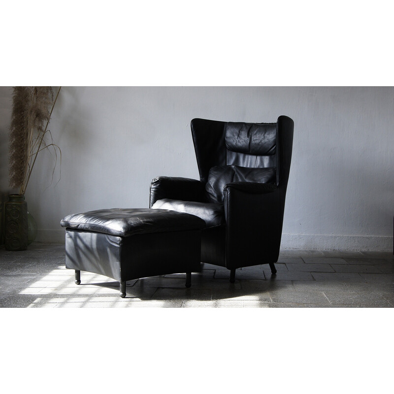 Vintage black leather lounge armchair with footrest by De Sede, Canada 1980