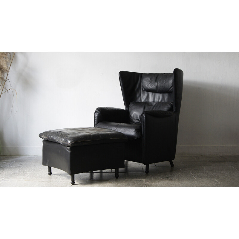 Vintage black leather lounge armchair with footrest by De Sede, Canada 1980
