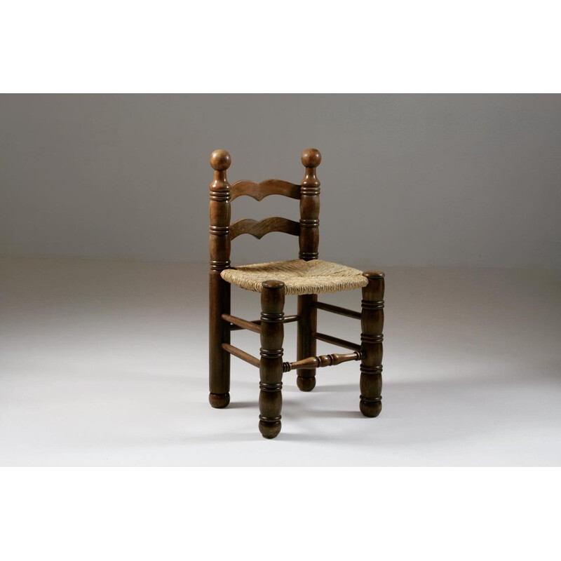 Conjunto de 8 sillas vintage de madera y asientos de paja de Charles Dudouyt, Francia 1950