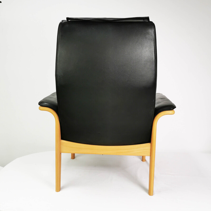 Vintage leather armchair with footrest, Denmark 1980s