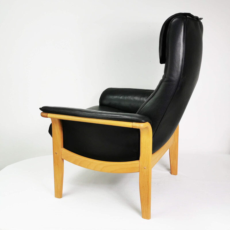 Vintage leather armchair with footrest, Denmark 1980s