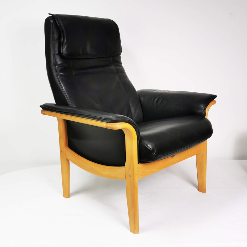 Vintage leather armchair with footrest, Denmark 1980s