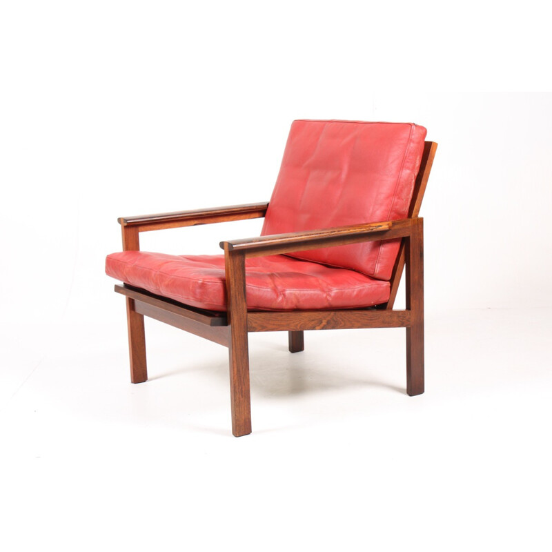 Fauteuil "Capella" rouge en palissandre et en cuir par Illum Wikkelsø pour Eilersen - 1960