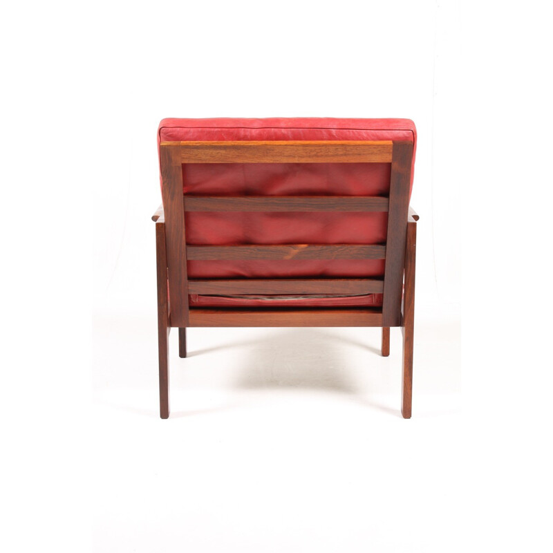 Fauteuil "Capella" rouge en palissandre et en cuir par Illum Wikkelsø pour Eilersen - 1960