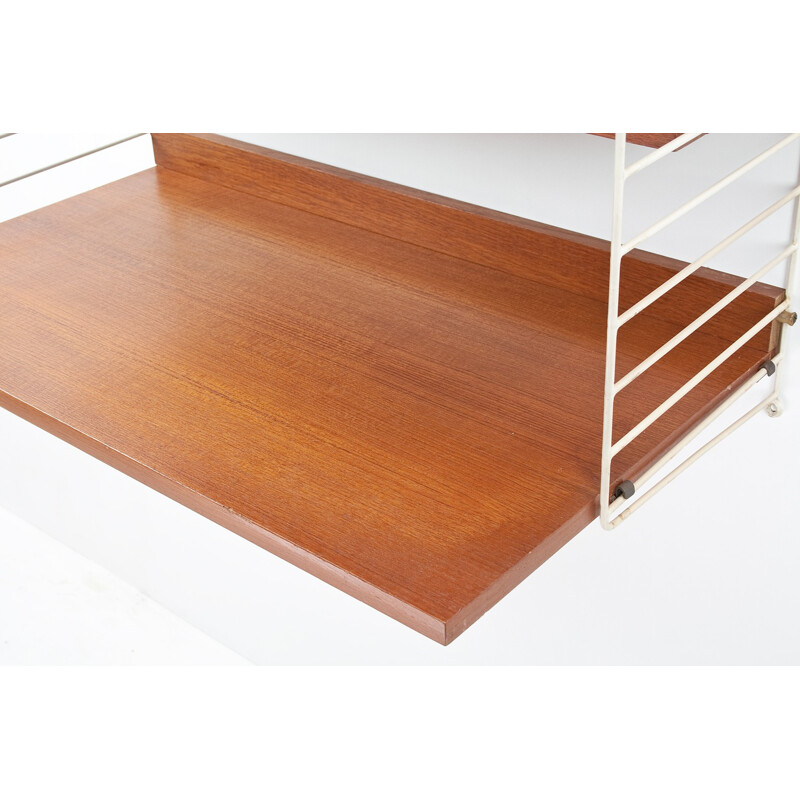 Modular wall system in teak and metal with several shelves by Nils Strinning for AB String - 1950s