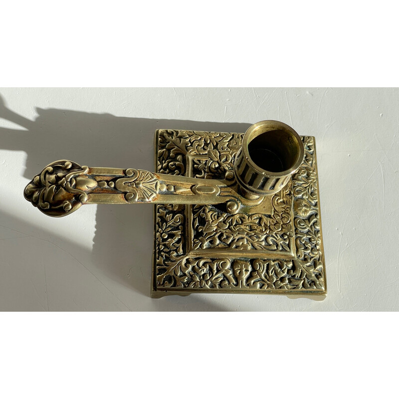 Vintage brass candlestick with face design