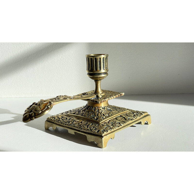 Vintage brass candlestick with face design