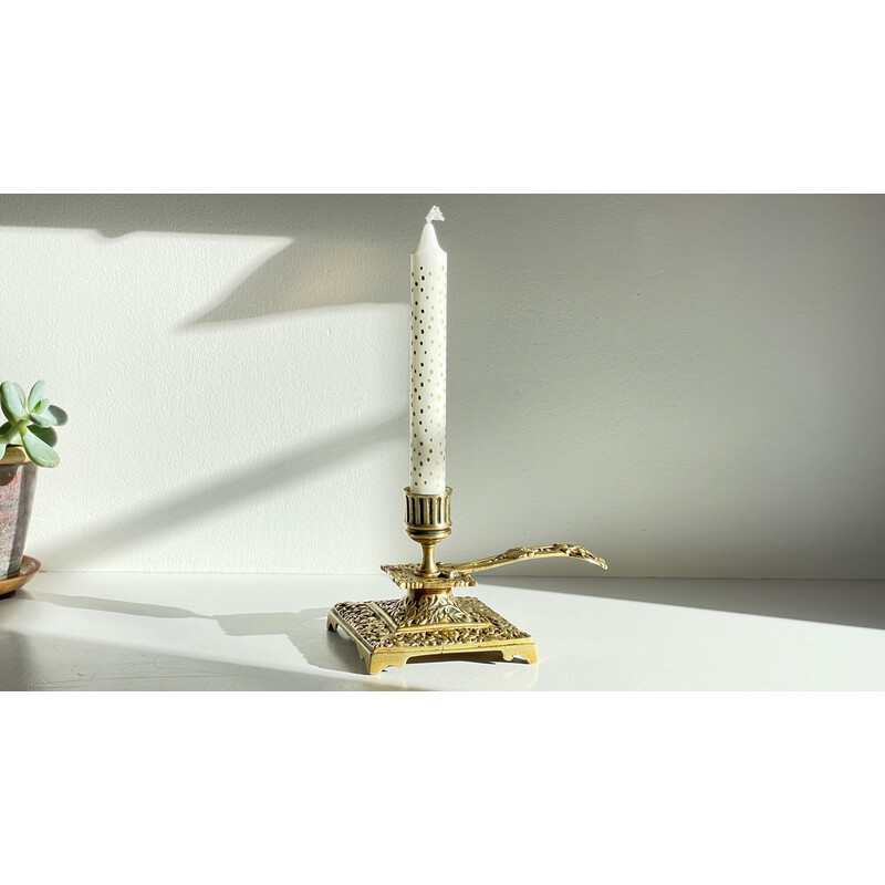 Vintage brass candlestick with face design