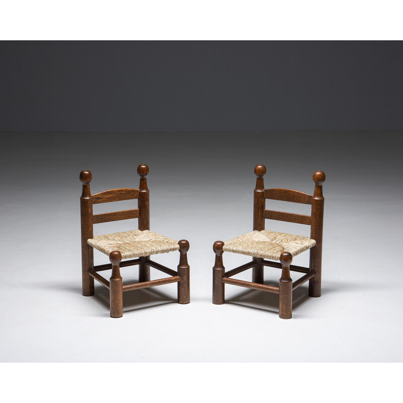 Pair of vintage oakwood and cane stools by Charles Dudouyt, France