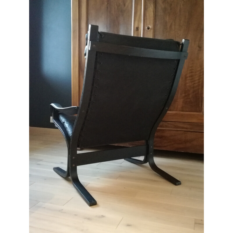 Scandinavian armchair in black leather and ottoman Ingmar Relling - 1970s