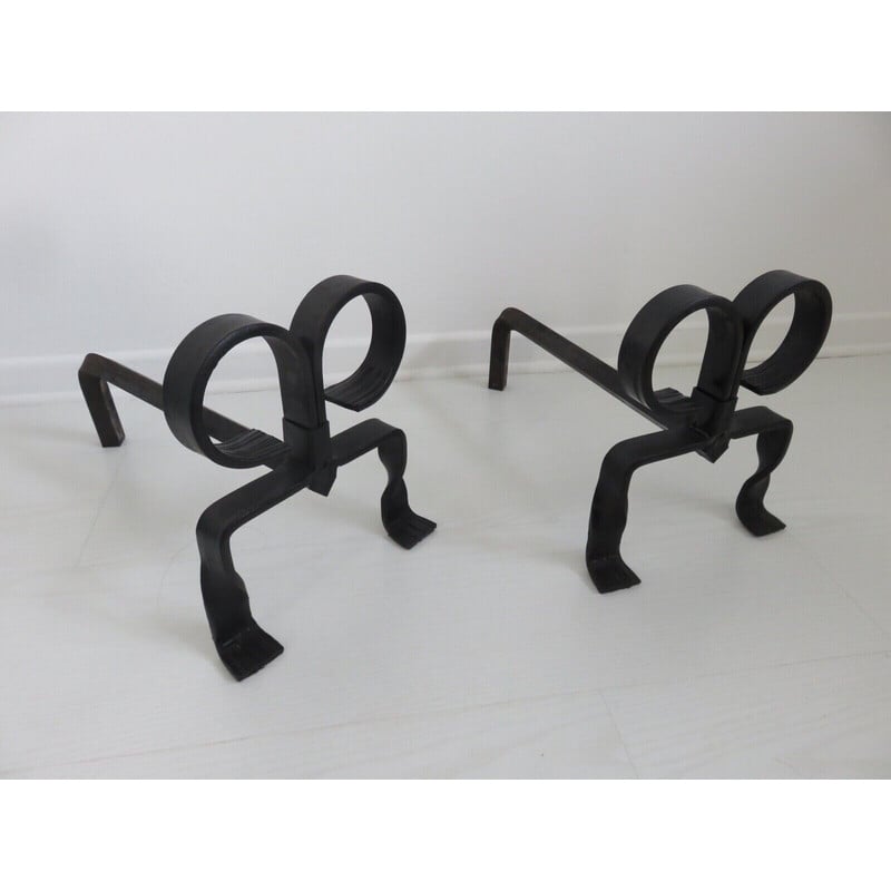 Pair of vintage "ibex" andirons in wrought iron, France 1930-1940s
