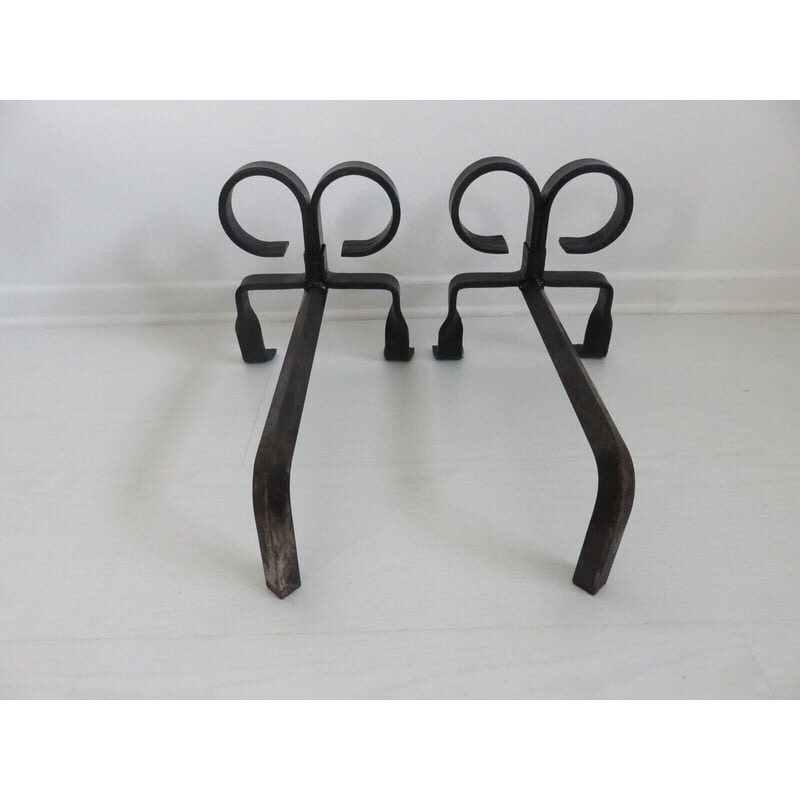 Pair of vintage "ibex" andirons in wrought iron, France 1930-1940s