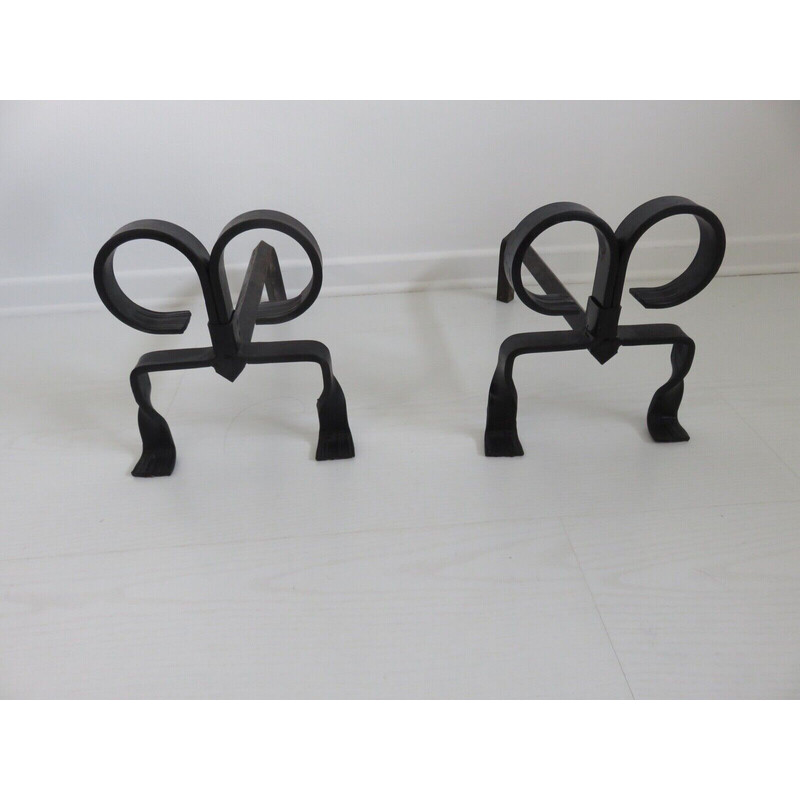 Pair of vintage "ibex" andirons in wrought iron, France 1930-1940s