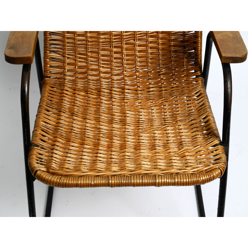 Mid century rocking chair in black painted metal and rattan