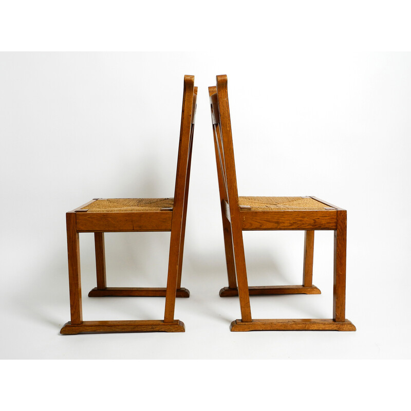 Par de cadeiras de madeira de carvalho vintage com pés de derrapagem e assentos de vime
