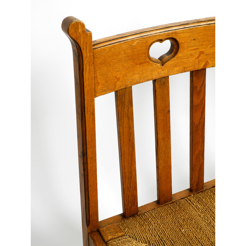 Pareja de sillas vintage de madera de roble con patas deslizantes y asientos de mimbre