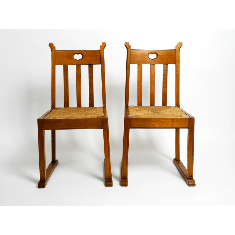 Coppia di sedie vintage in legno di quercia con piedini a slitta e sedute in vimini