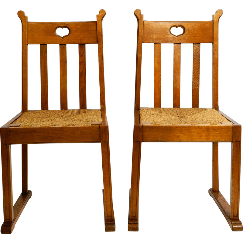 Pair of vintage oakwood chairs with skid feet and wicker seats