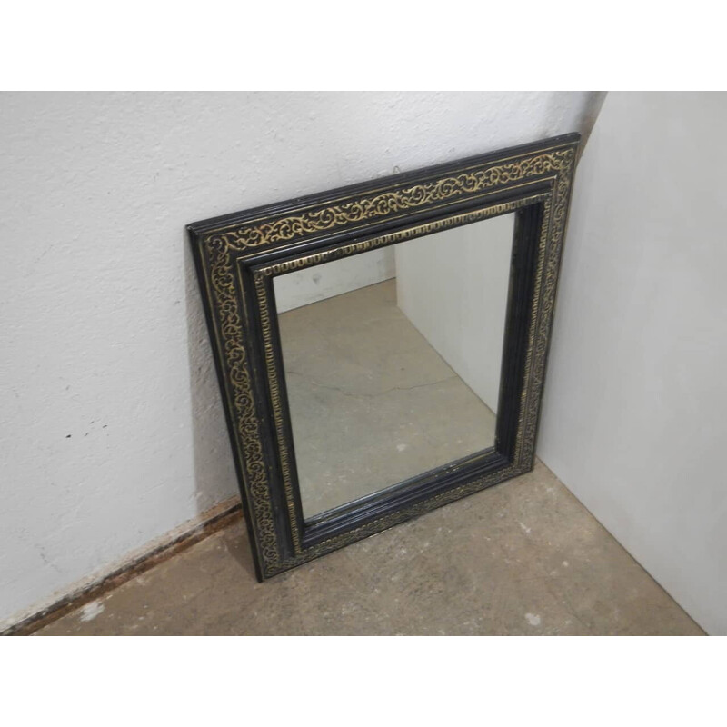 Vintage zwarte en gouden houten spiegel