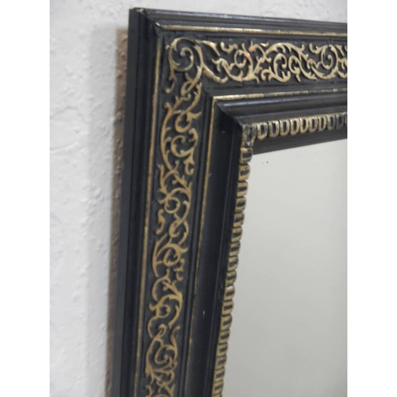 Vintage zwarte en gouden houten spiegel
