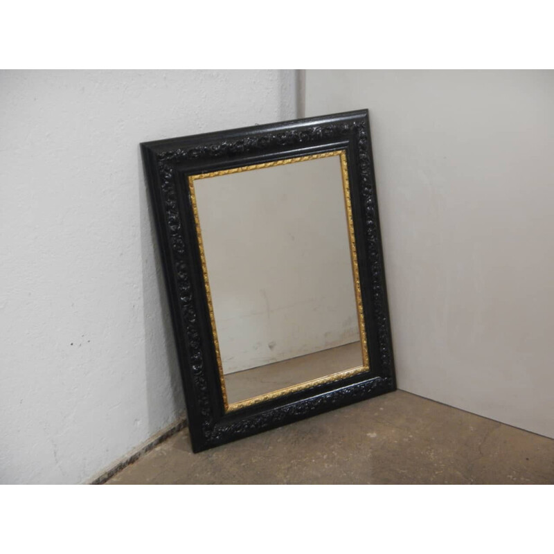 Specchio vintage in legno nero e oro