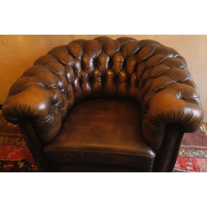 Vintage Chesterfield club armchair and ottoman in chestnut-coloured leather