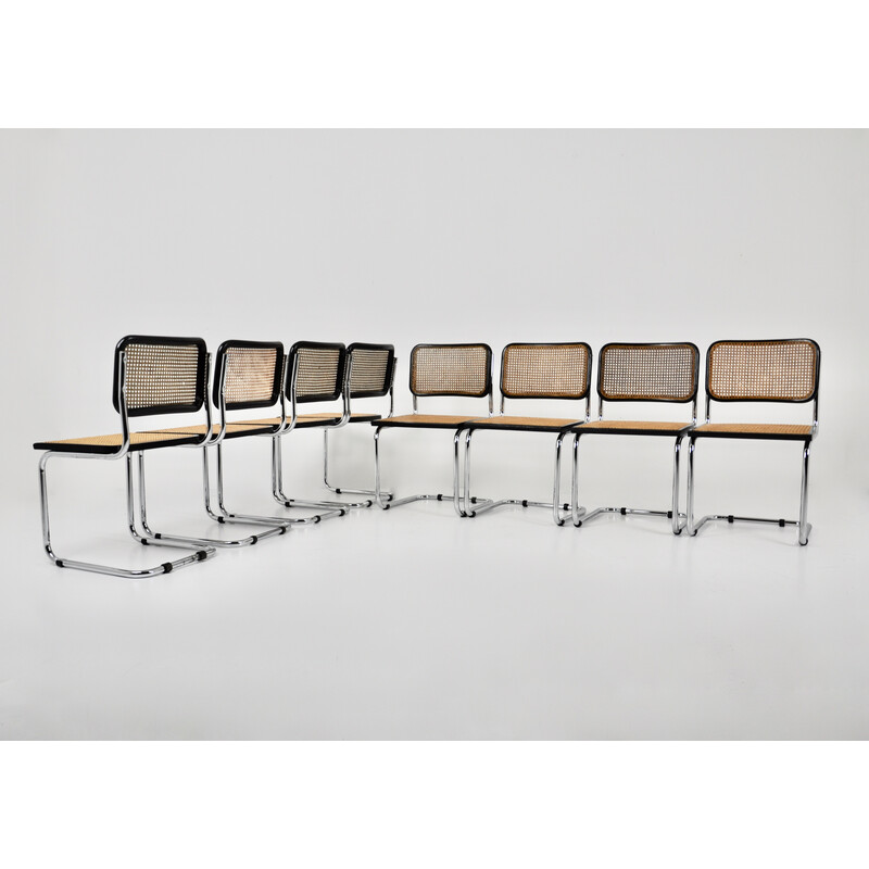 Set of 8 vintage black chairs in metal, wood and rattan by Marcel Breuer