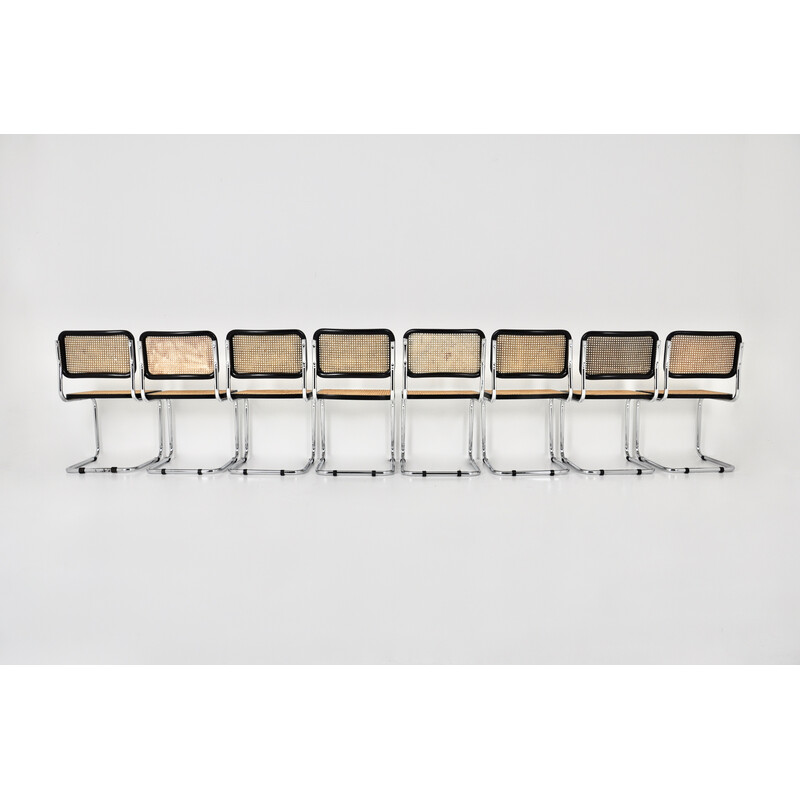 Conjunto de 8 cadeiras pretas vintage em metal, madeira e rotim de Marcel Breuer