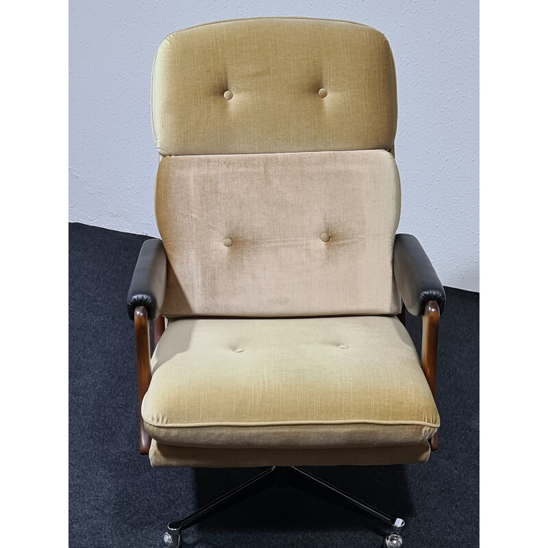 Vintage velvet swivel armchair