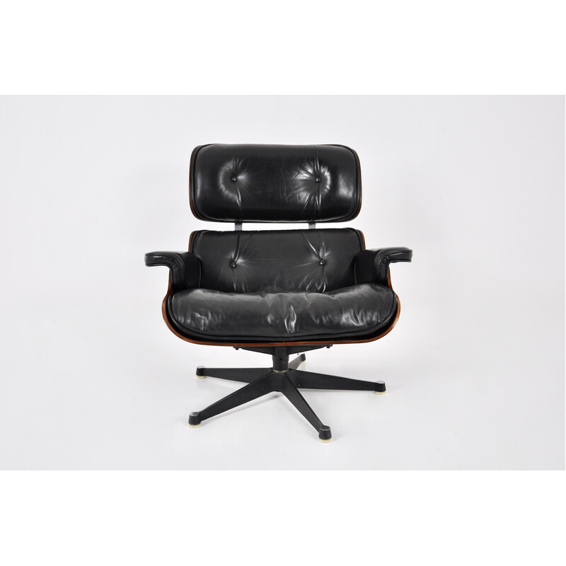 Poltrona vintage in pelle nera e legno di Charles e Ray Eames per Icf Herman Miller, 1970