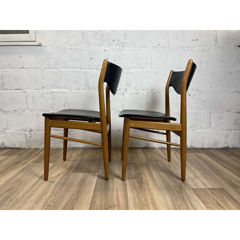 Pair of Scandinavian vintage chairs in solid oakwood and black skai, 1960