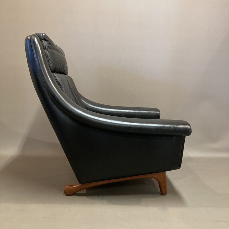 Scandinavian vintage armchair in black leather and teak by Aage Christiansen, 1950