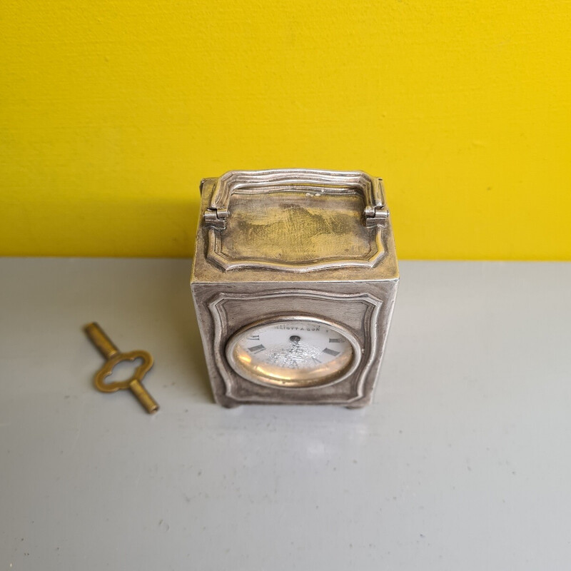 Reloj de viaje vintage de plata de Elliott and Son London
