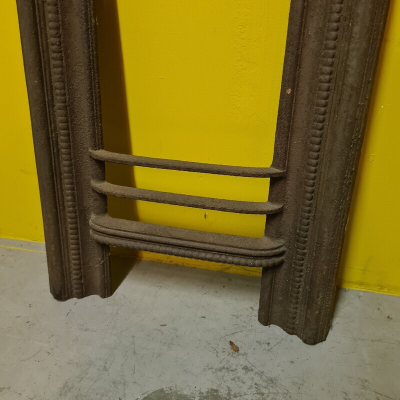 Vintage cast iron fireplace front with shell motif