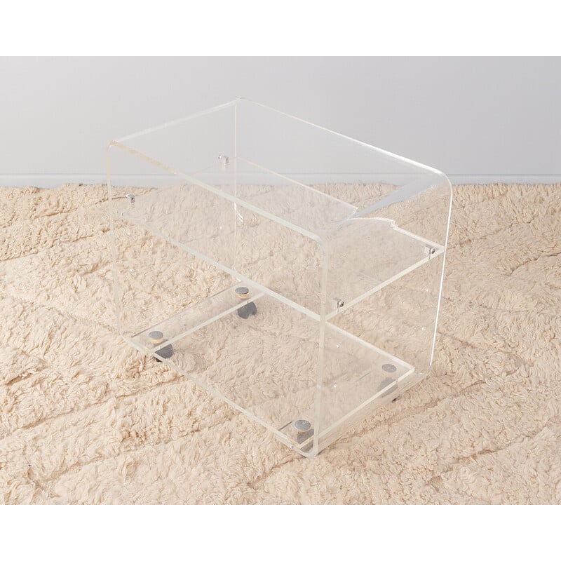 Vintage transparent acrylic side table with chrome-plated castors, Germany 1960s