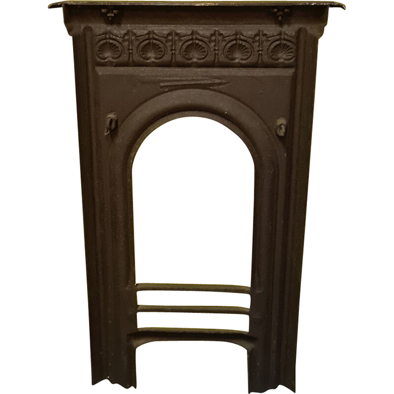 Vintage cast iron fireplace front with shell motif