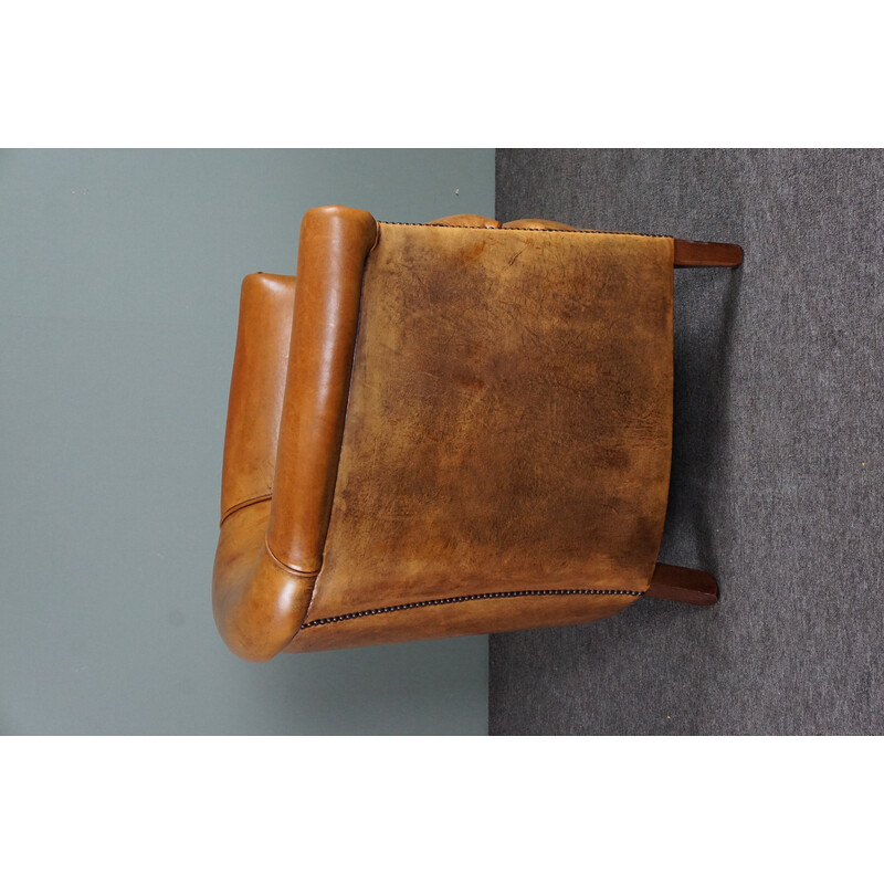 Vintage cognac colored sheep leather club armchair