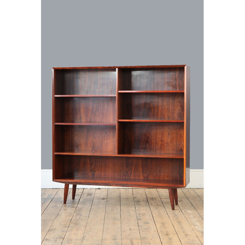 Large rosewood bookcase with conical legs - 1960