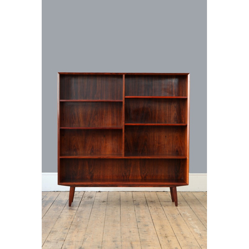 Large rosewood bookcase with conical legs - 1960