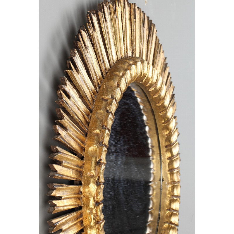 Sun - shaped mirror in golden wood - 1960s