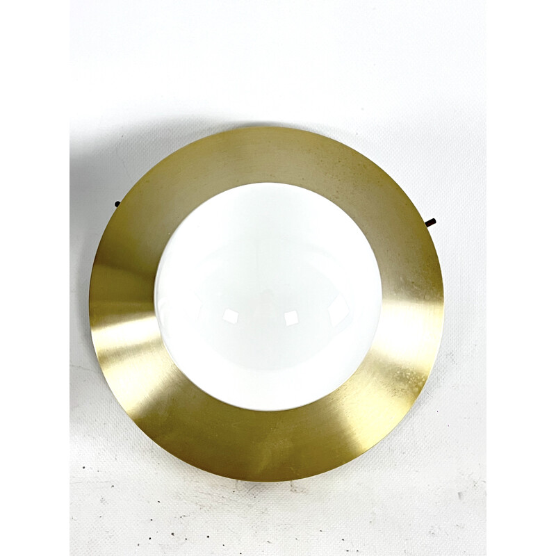 Pair of vintage round gilded aluminum wall lamps by Stilux Milano