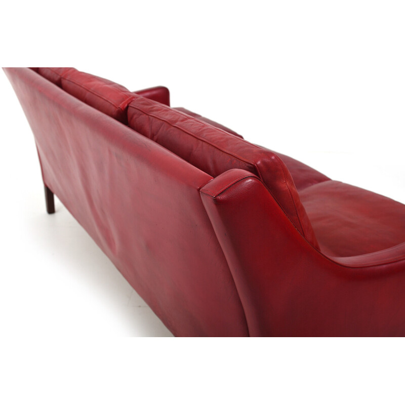 Vintage patinated Indian red leather sofa by Arne Wahl Iversen