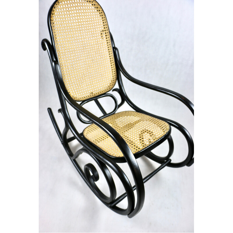 Vintage raffia and black rocking chair