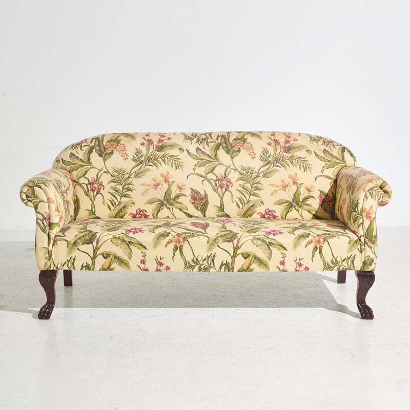 Vintage two-seater sofa with textile upholstery and mahogany legs