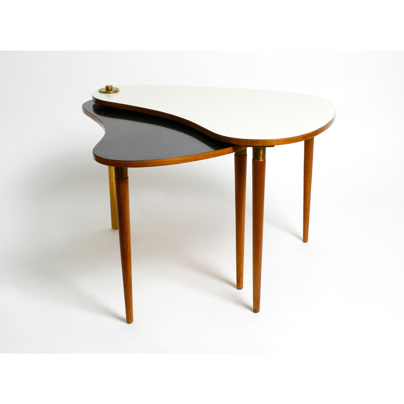 Mid century kidney side table consisting of two twistable tables